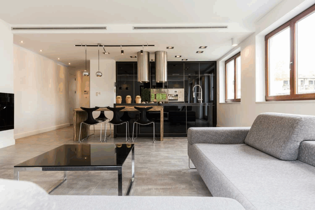 Sala de estar integrada à cozinha com design contemporâneo.