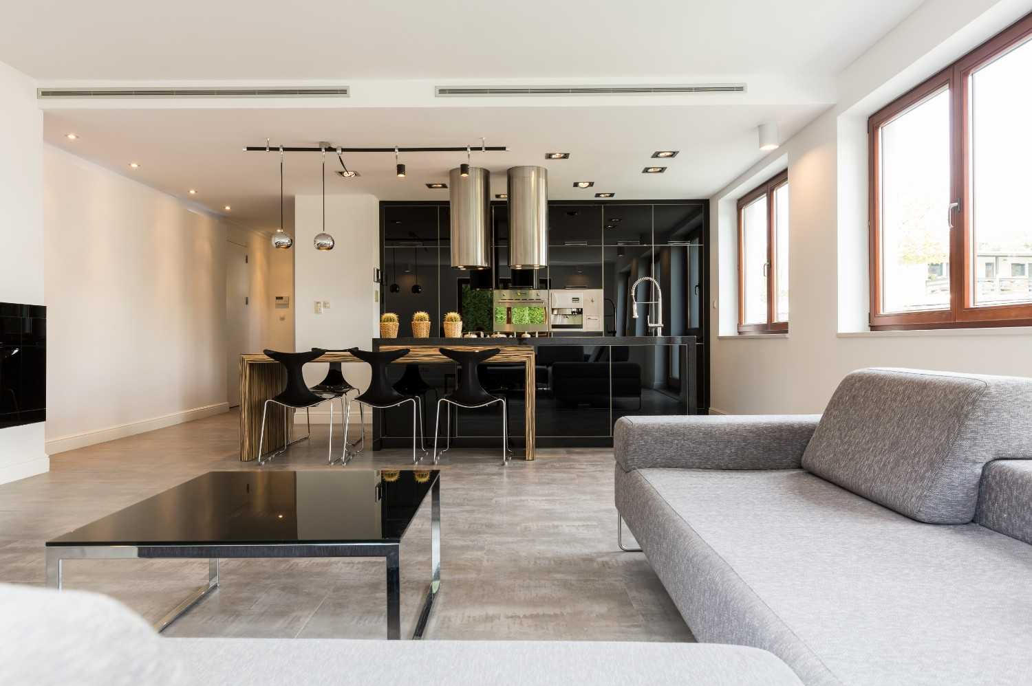 Sala de estar integrada à cozinha com design contemporâneo.